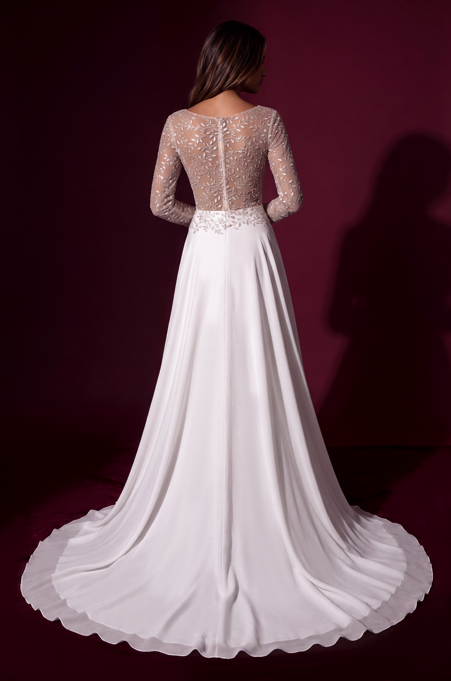White long-sleeve formal dress, back view.